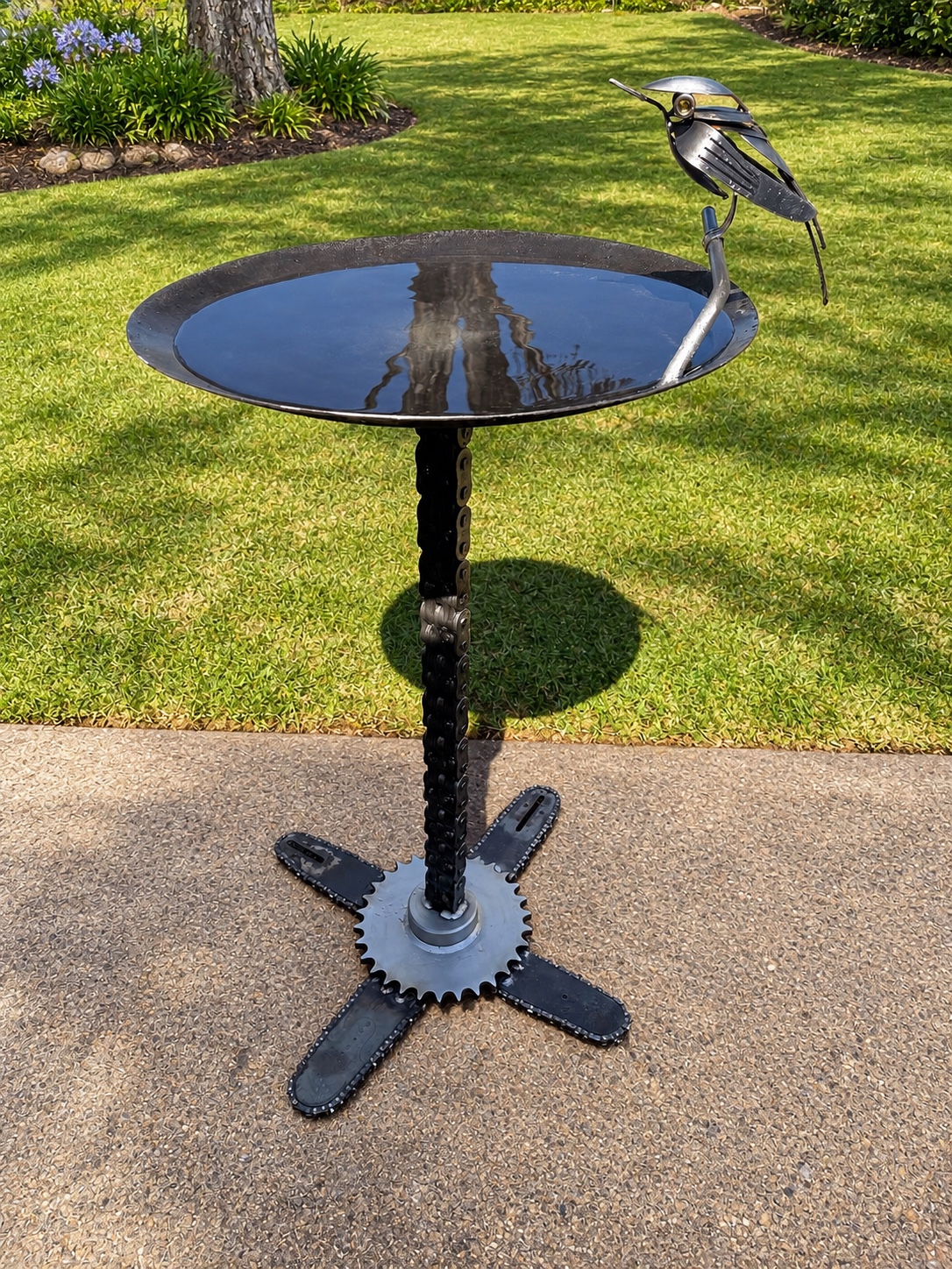 Complete steel bird bath with chain pedestal, sprocket base and metal bird